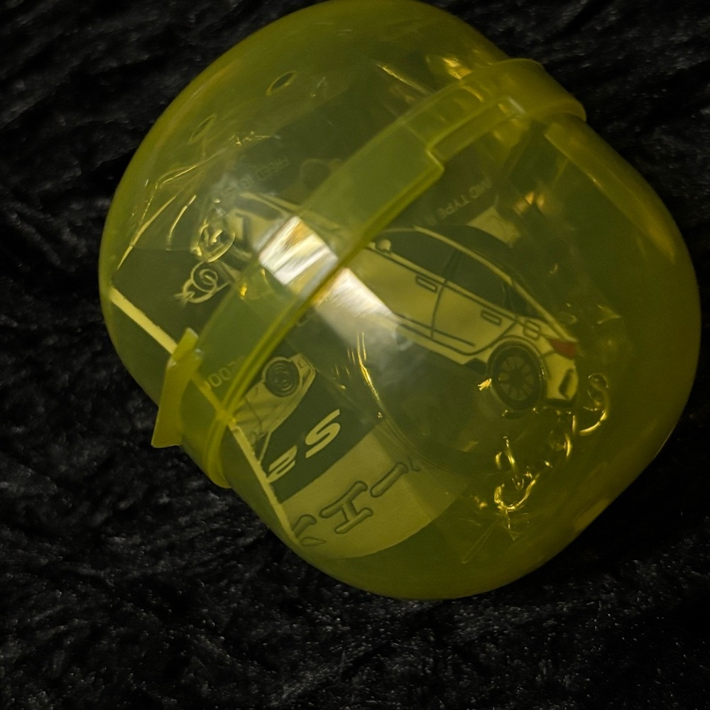 Yellow Capsule Toy with Honda Car Design